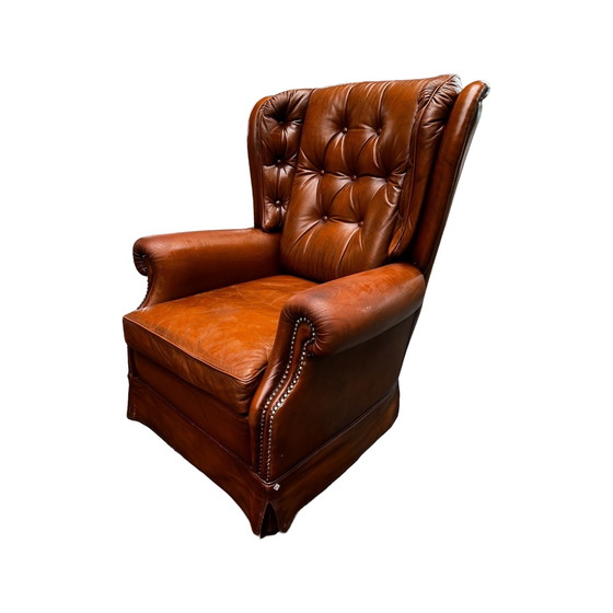 Image 1 of Comfortable armchair made of genuine leather with signs of wear