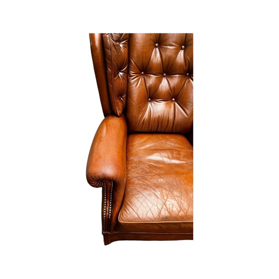 Image 1 of Comfortable armchair made of genuine leather with signs of wear