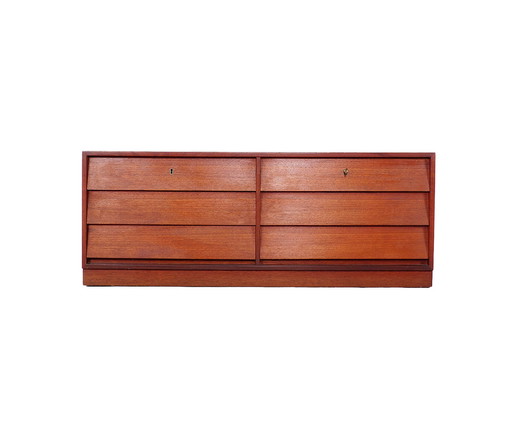 Vintage low teak sideboard with drawers from the 1960s