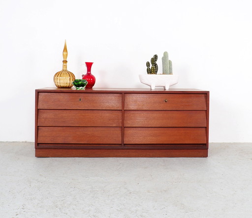 Vintage low teak sideboard with drawers from the 1960s