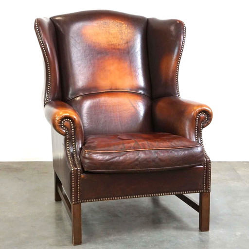 Fauteuil à oreilles en cuir de mouton