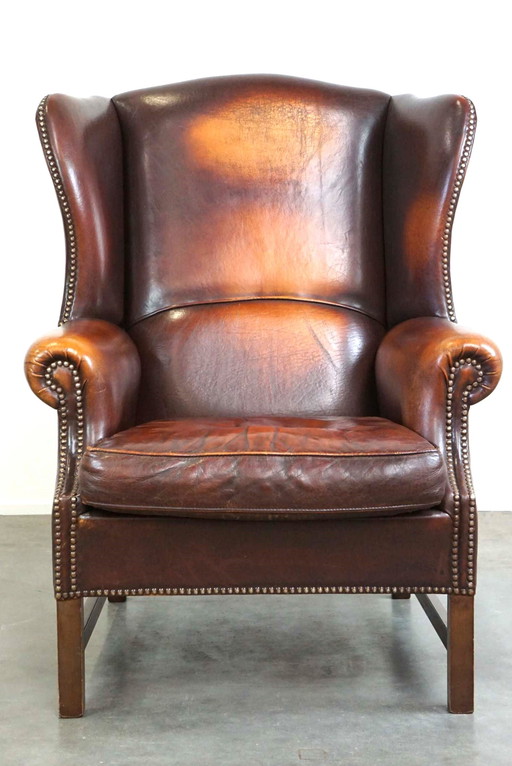 Fauteuil à oreilles en cuir de mouton