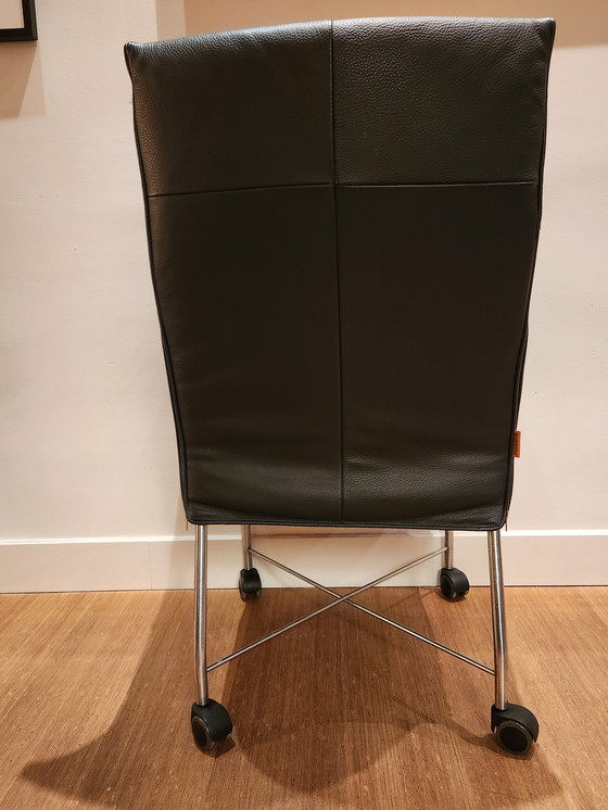 Image 1 of 6 X Montis Dining Chairs Black Leather, Stainless Steel Base With Wheels