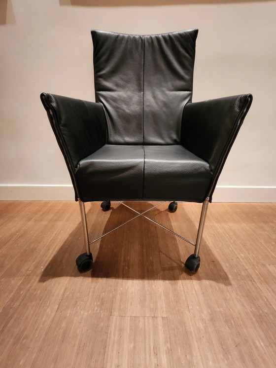 Image 1 of 6 X Montis Dining Chairs Black Leather, Stainless Steel Base With Wheels