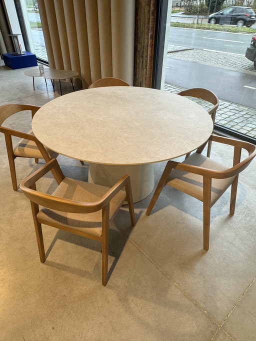 Round Dining Table With Beige Colored Ceramic Table Top