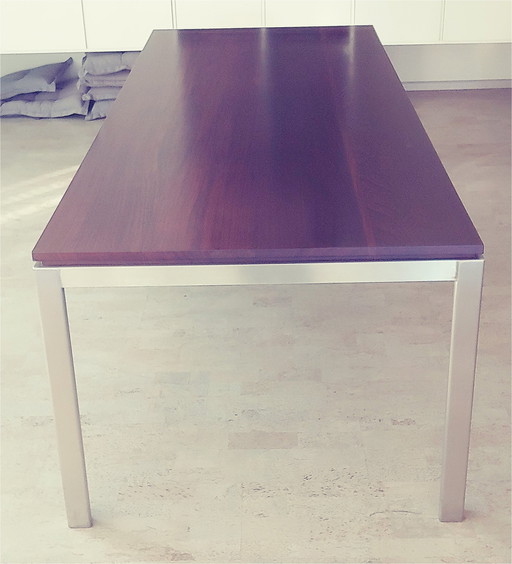 Design dining table with stainless steel frame with wooden top