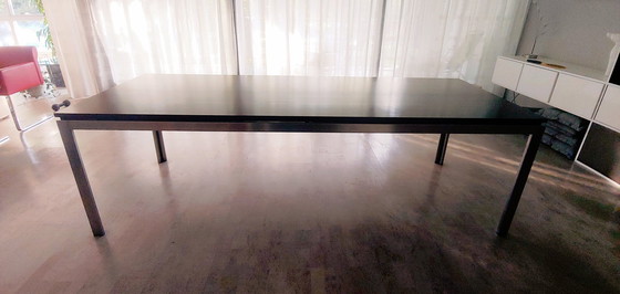 Image 1 of Design dining table with stainless steel frame with wooden top