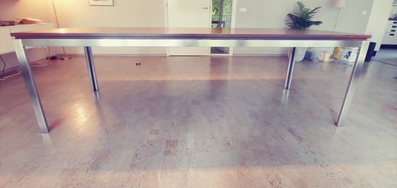 Image 1 of Design dining table with stainless steel frame with wooden top