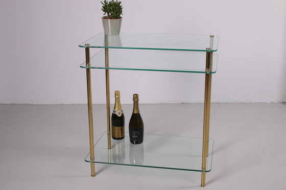 Image 1 of Hollywood Regency Side Table with gold legs.