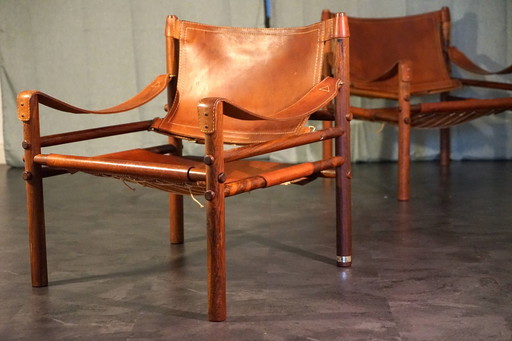 Scandinavian vintage Sirocco Safari teak armchair in cognac-colored leather by Arne Norell for Arne Norell Ab, 1960s, set of 2