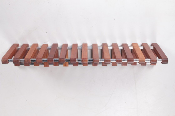 Image 1 of Vintage teak wall coat rack with chrome from the 1960s.