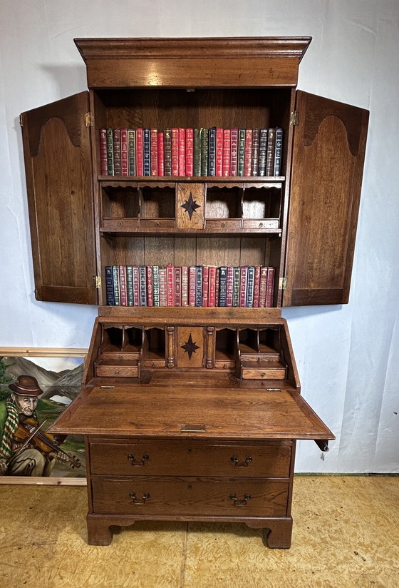 Image 1 of  Libreria vintage in rovere massello Brocante, 1880, scomparti nascosti e interni attrezzati