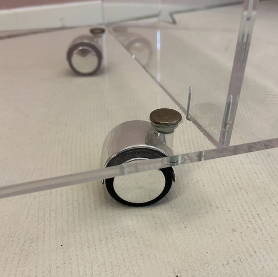 Image 1 of Vintage plexiglass side table on wheels