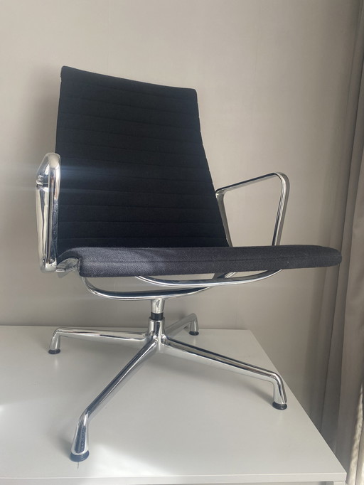 Vitra EA115 aluminum lounge chair by Charles & Ray Eames