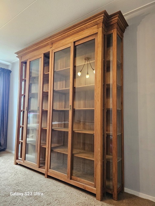 Wooden display case with paneled doors