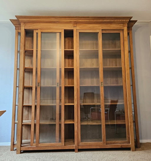 Wooden display case with paneled doors