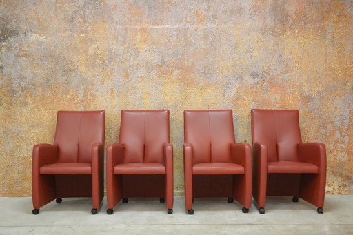 8 red leather wheeled Leolux Lapita design chairs