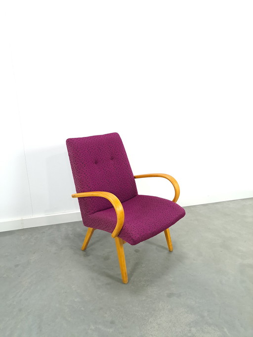 Purple armchair with wooden armrests