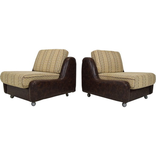 Pair of mid-century leatherette armchairs on the wheels, Czechoslovakia 1970s