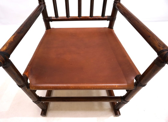 Image 1 of Fauteuil en rotin Manou avec assise en cuir, 1960