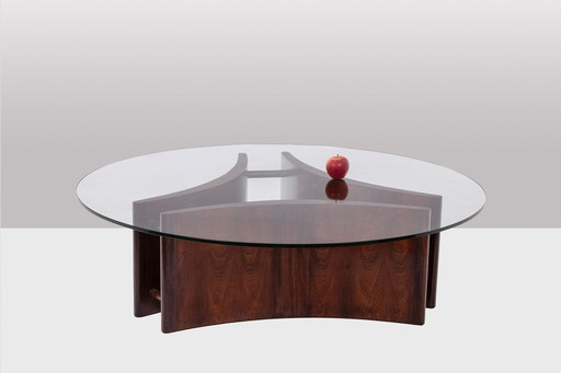 Concave rosewood coffee table. Circa 1970.