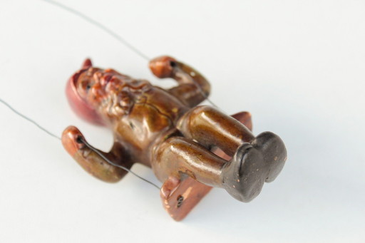 Antique Heissner garden gnome on a swing