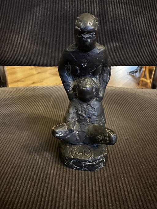 Figurine de Tony van de Vorst jouant avec des enfants