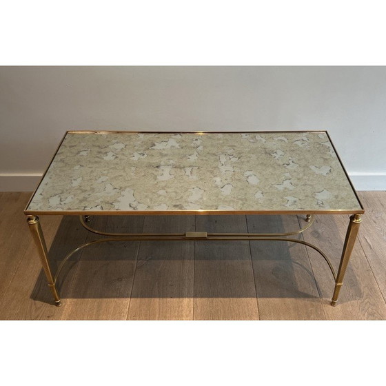 Image 1 of Neoclassical style brass coffee table with faux-antiques mirror top. French Work by Maison Jansen. Circa 1940