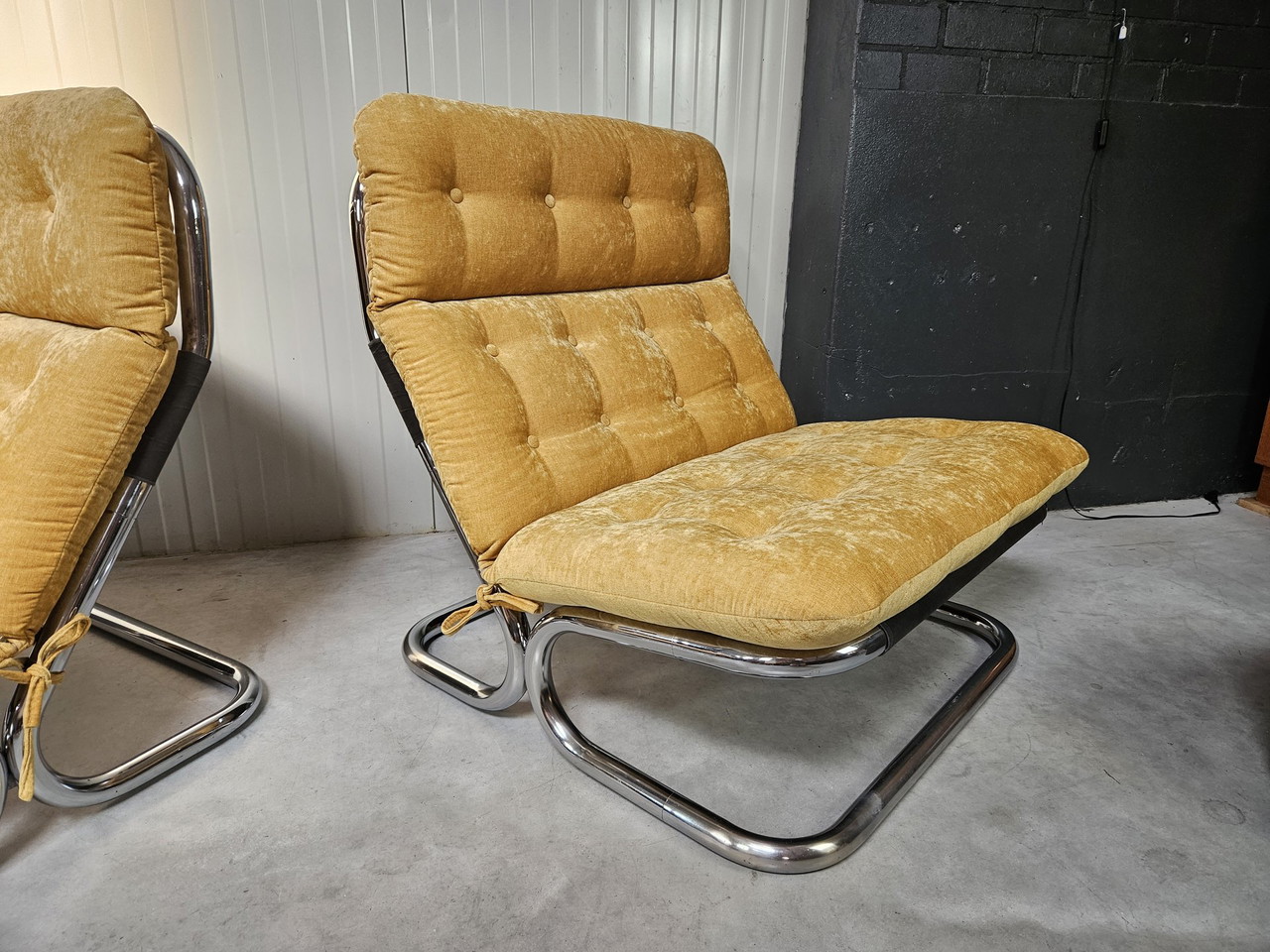 2x tubular frame armchairs, ocher yellow, reupholstered