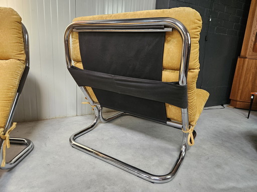 2x tubular frame armchairs, ocher yellow, reupholstered