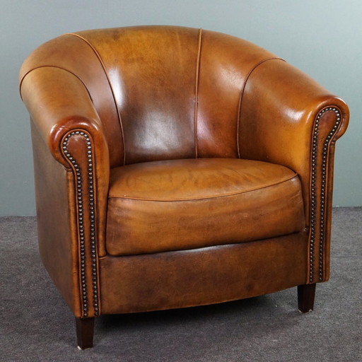 Fauteuil club en cuir de mouton avec coussin d'assise fixe