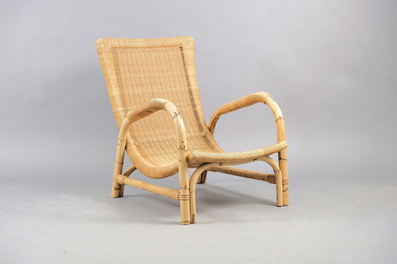 Image 1 of Arco rattan armchair