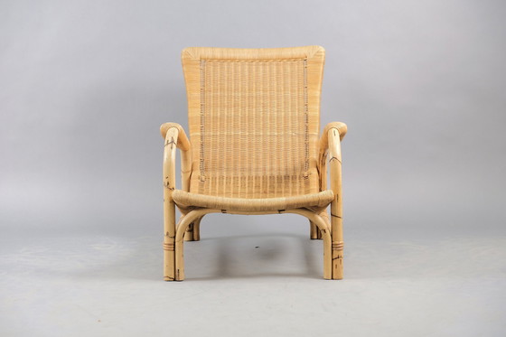 Image 1 of Arco rattan armchair