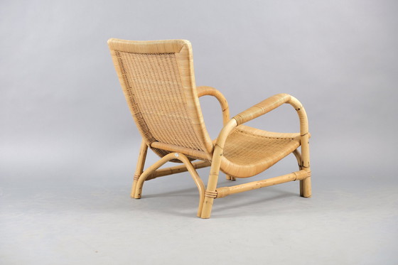 Image 1 of Arco rattan armchair