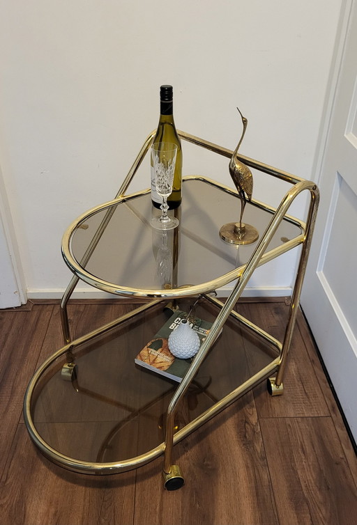 Vintage Hollywood Regency Brass/Smoking Glass Bar Trolley.