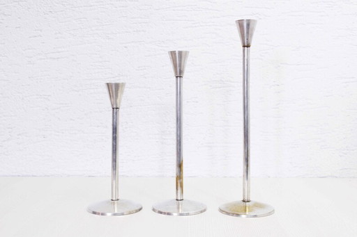 Trio of silver metal candlesticks from the 1950s