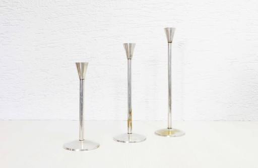 Trio of silver metal candlesticks from the 1950s