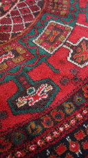 Round vintage wool rug with red and yellow-brown shades 150x150cm