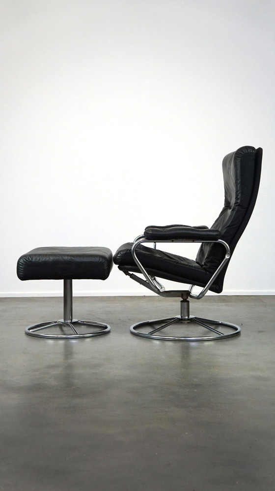 Image 1 of Black cowhide leather swivel chair + footstool