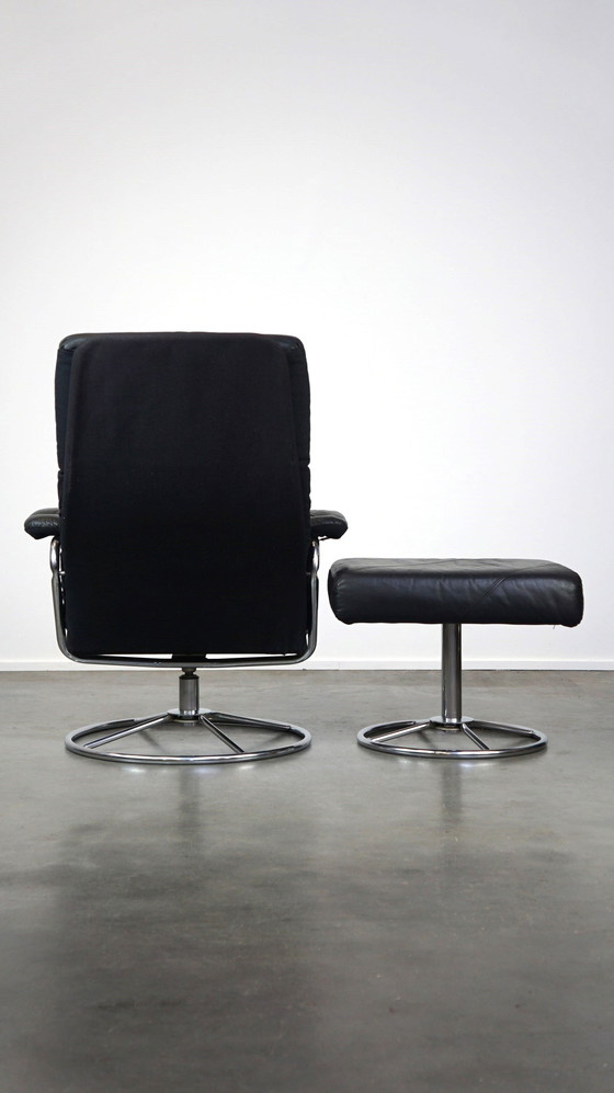 Image 1 of Black cowhide leather swivel chair + footstool