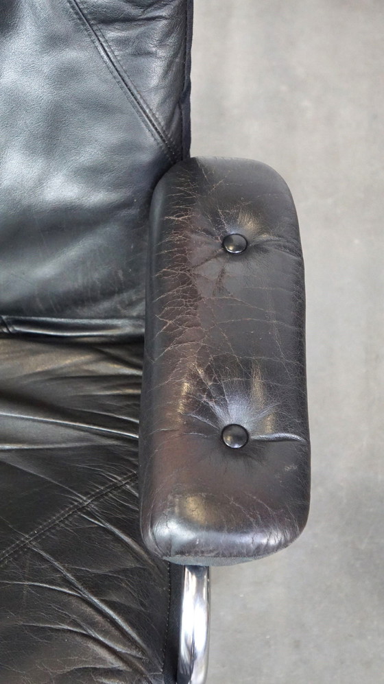 Image 1 of Black cowhide leather swivel chair + footstool