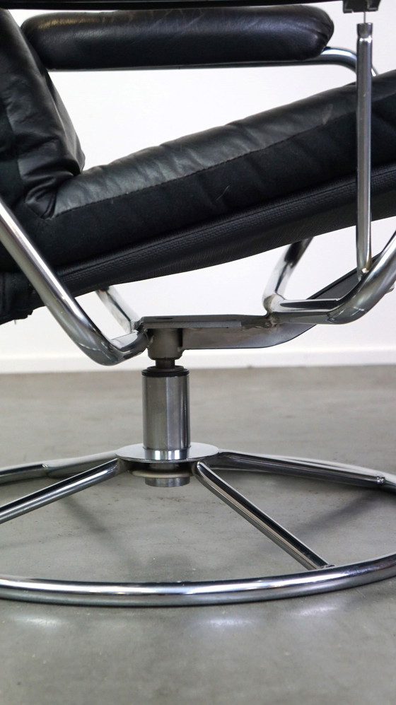 Image 1 of Black cowhide leather swivel chair + footstool