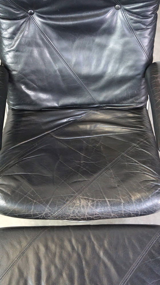 Image 1 of Black cowhide leather swivel chair + footstool