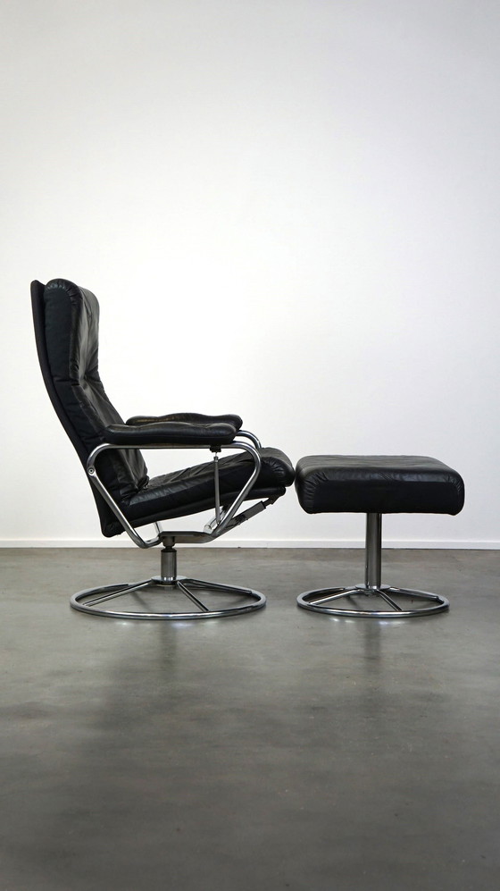 Image 1 of Black cowhide leather swivel chair + footstool