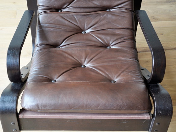 Image 1 of Midcentury lounge chair with a brown wooden frame