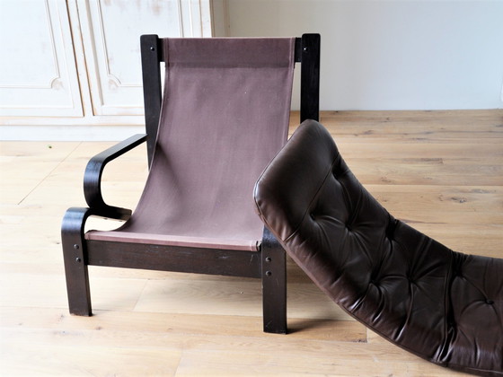 Image 1 of Midcentury lounge chair with a brown wooden frame