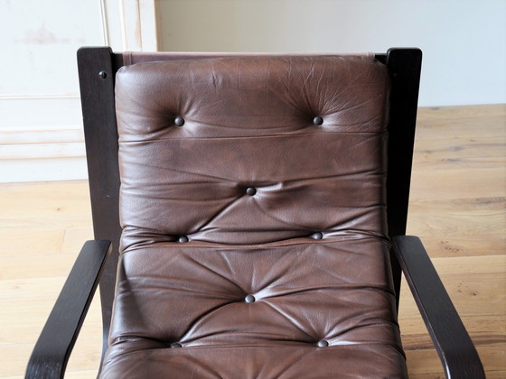 Image 1 of Midcentury lounge chair with a brown wooden frame