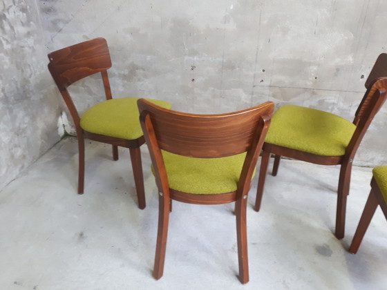 Image 1 of 4 green chairs