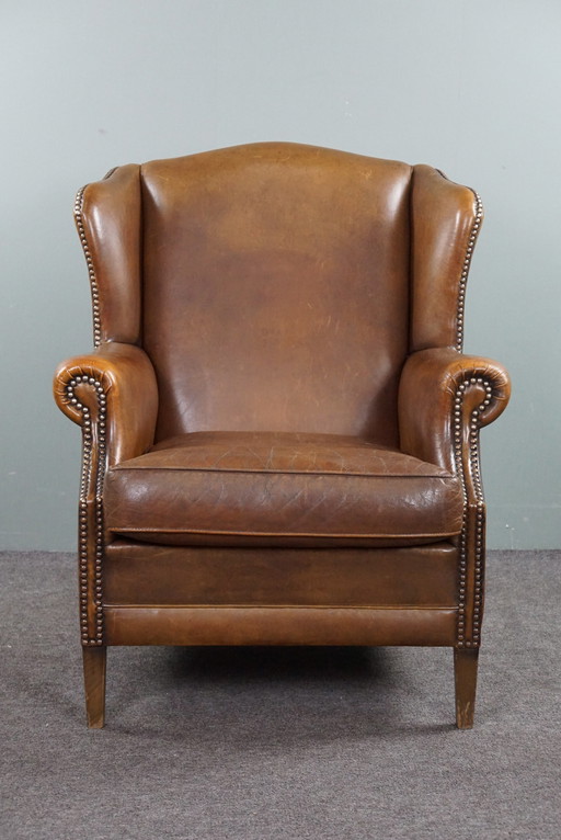 Wing armchair, sheepskin