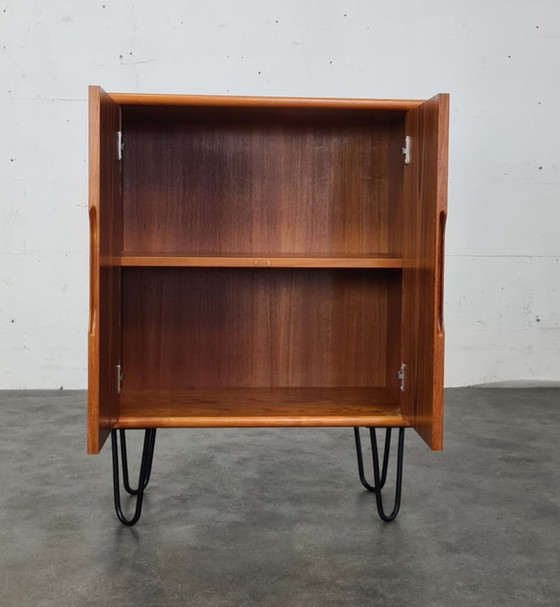 Image 1 of Vintage teak hairpin cabinet